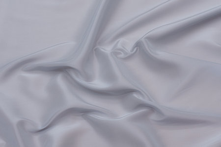 Abstract background texture of natural blue color fabric. Fabric texture of natural cotton or linen, silk or satin, wool or jersey textile material. Luxurious blue canvas background.の写真素材