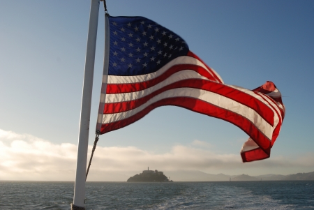 Stars and Stripes flag with Alcatraz island in the backgroundの写真素材