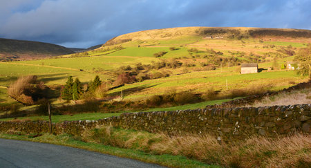 Winter evening sun over farmland in the Peak District National Park, England