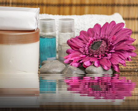 Spa concept with stones, water and flower.の写真素材