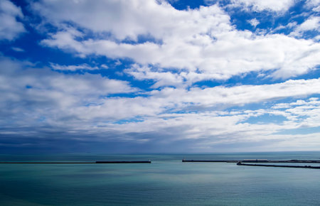 View of the sea with blue sky and white clouds.