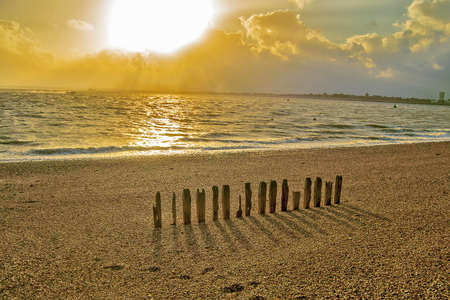Empty beach in south England during sunset.の写真素材