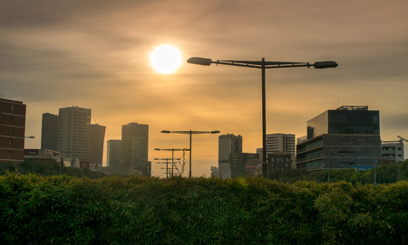 Barcelona, Spain - December 29, 2015. Sunset over the skyscrapers in Barcelona. Barcelona is the cosmopolitan capital of Catalonia region.のeditorial素材