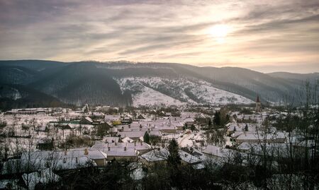 Village in the mountains of Slovakia at winter time.の写真素材
