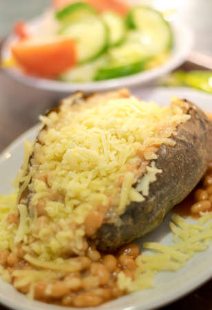 Jaclet potato with beans and cheese served with saladの写真素材