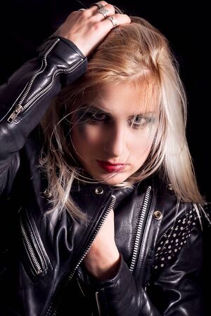 Young blonde woman in a black leather jacketの写真素材
