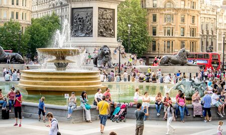 London, England - JULY 27, 2014 - Busy touristic Trafalgar square in central London, England. Trafalgar square is an important historic and touristic place in central London.のeditorial素材