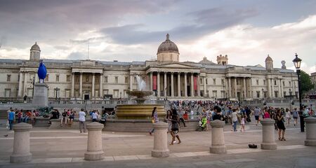 London, England - July 26, 2014 - Busy Trafalgar square in central London during sunset. Trafalgar square is an important historic and touristc place in London.のeditorial素材