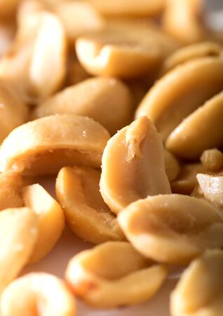 Closeup image of salted nuts on a tableの写真素材