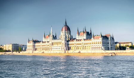 View of the Budapest parliament with the river Danube in the foregroundの写真素材