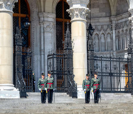 Hungarian guards standing on duty at the entrance of the Hungarian parliament in Budapest.のeditorial素材