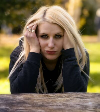 Beautiful woman with long blonde hair posingの写真素材