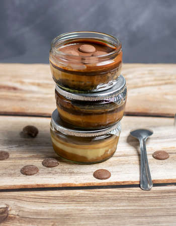 Chocolate pudding with chocolate buttons on a wooden backgroundの写真素材