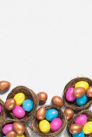 Easter background. Colourful easter eggs in nests.