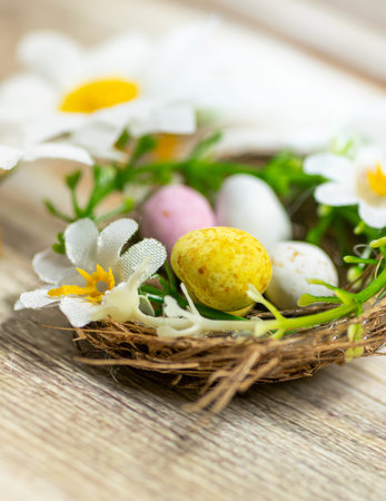 Nest filled with Easter eggs and flowers