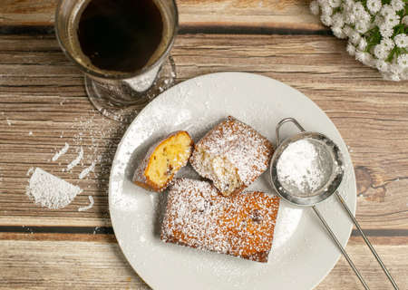 Freshly made chocolate chip cakes served with coffeeの写真素材