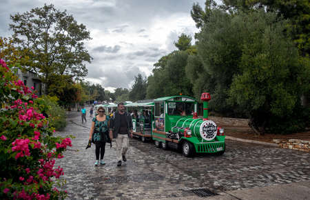 Small green tourist train in the center of Athens.のeditorial素材