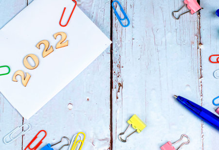 Office theme with the year 2022 on a wooden backgroundの写真素材