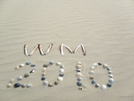 World cup 2010 made of mussels on a sunny beachの写真素材