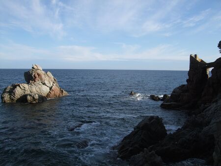 Big rock in the sea by the coast in Lloret de Mar, Costa Brava, Spainの写真素材