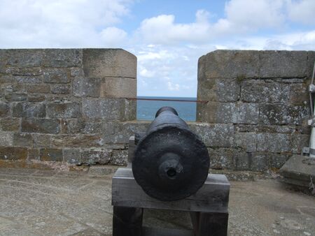 View out to sea from a fort in St Malo, France with a canon.の写真素材