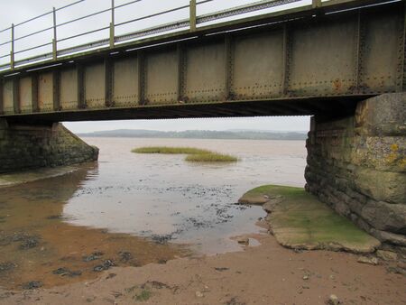 Railway bridge over tidal inlet in Exton, Devon UKの写真素材