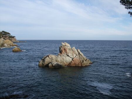 Rock sticking out of the water. Lloret de Mar, Spainの写真素材
