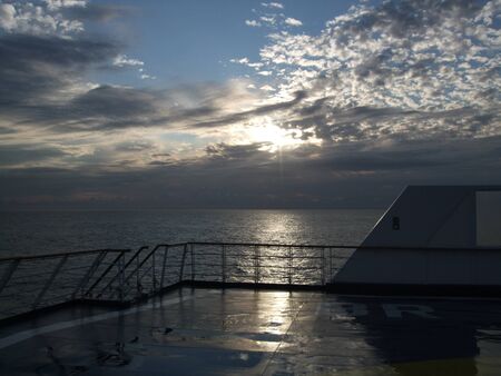 Sunset over the Bristol Channel from Weston super Mare pier, Somerset UKの写真素材