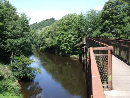 Old abandoned railway bridge across the River Wye, South Wales, UKの写真素材