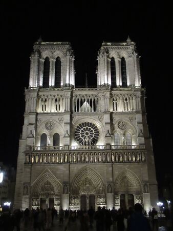 Notre Dame cathedral at night Paris, Franceの写真素材