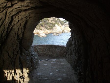 Tunnel through rock on coastal path. Lloret de Mar, Spainの写真素材