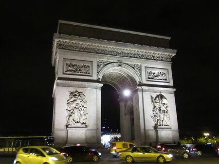 Arc de Triumphe at night with traffic, Paris, Franceの写真素材
