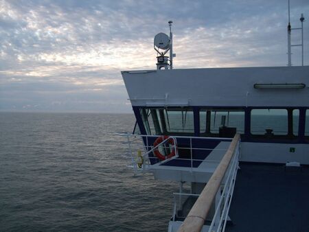 View of the sea from behind the wing of a ship's bridgeの写真素材