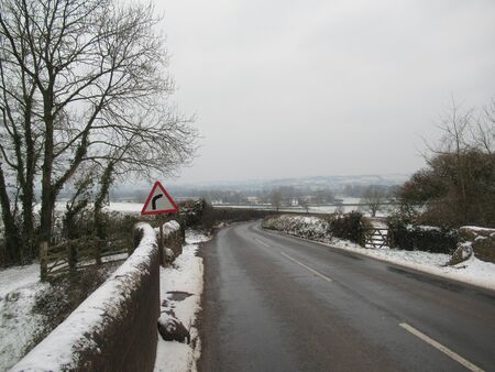 Country road in the winter with snowの写真素材