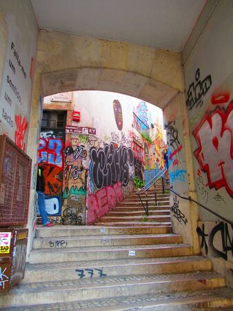 Passageway with graffiti in Lisbon, Portugalの写真素材