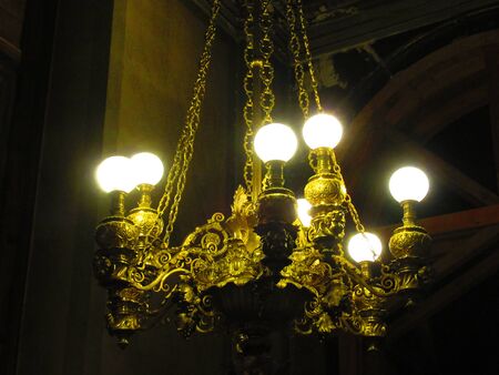 Hanging lights in a church in Paris, France.の写真素材