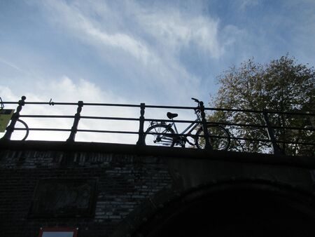 Bridge over a canal in Amsterdam with a bicycle. Hollandの写真素材