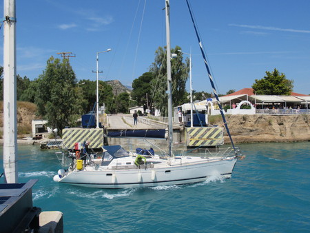 Yacht passing the Submersible Bridge of Isthmia at the south end of the Corinth Canal, Greeceのeditorial素材