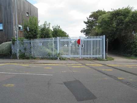 Closed gate to an abandoned railway. Shoeburyness, Essex, UKのeditorial素材