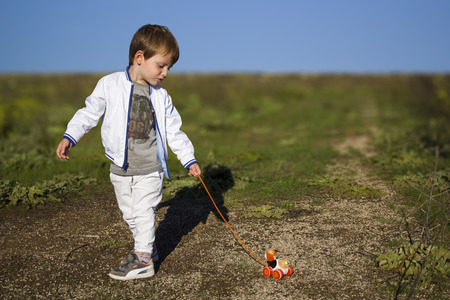 Child with the dog on a leashの写真素材