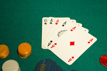 5 card poker, four aces on green table gamblingの写真素材
