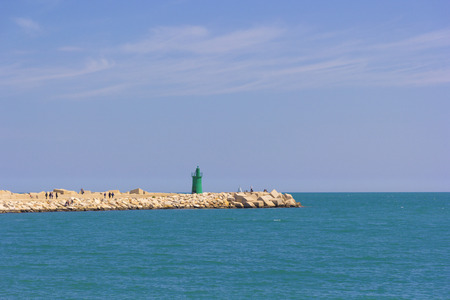 Green lighthouse of Trani, entrance to the portの写真素材