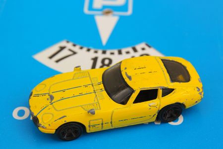 Disc parking and yellow carの写真素材