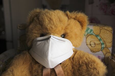 Coronavirus child: teddy bear with mask, quarantineの写真素材