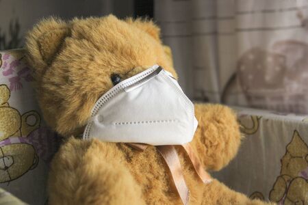 Coronavirus child: teddy bear with mask, quarantineの写真素材