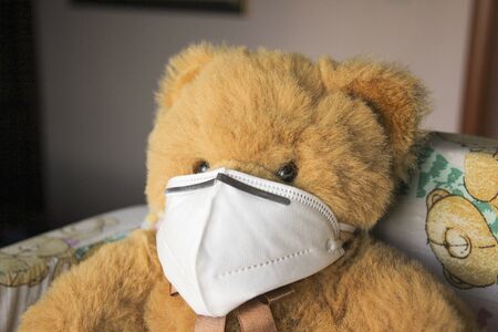 Coronavirus child: teddy bear with mask, quarantineの写真素材