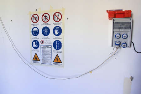 Building renovation: legislation, laws, warning and construction site electrical panelのeditorial素材