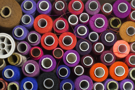 Background of colorful spools of thread.  Top viewの写真素材