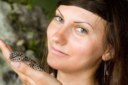 Beautiful young girl resting in park.の写真素材