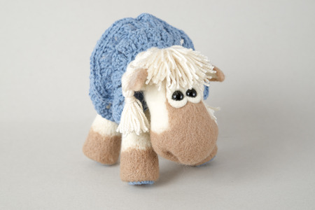 Toy horse on white background. Symbol of year on the Eastern calendar. Gift for holiday. Handmade Felt.の写真素材